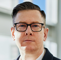 Alexander Hughes, PDG d'une société de crypto-trading, portrait.
